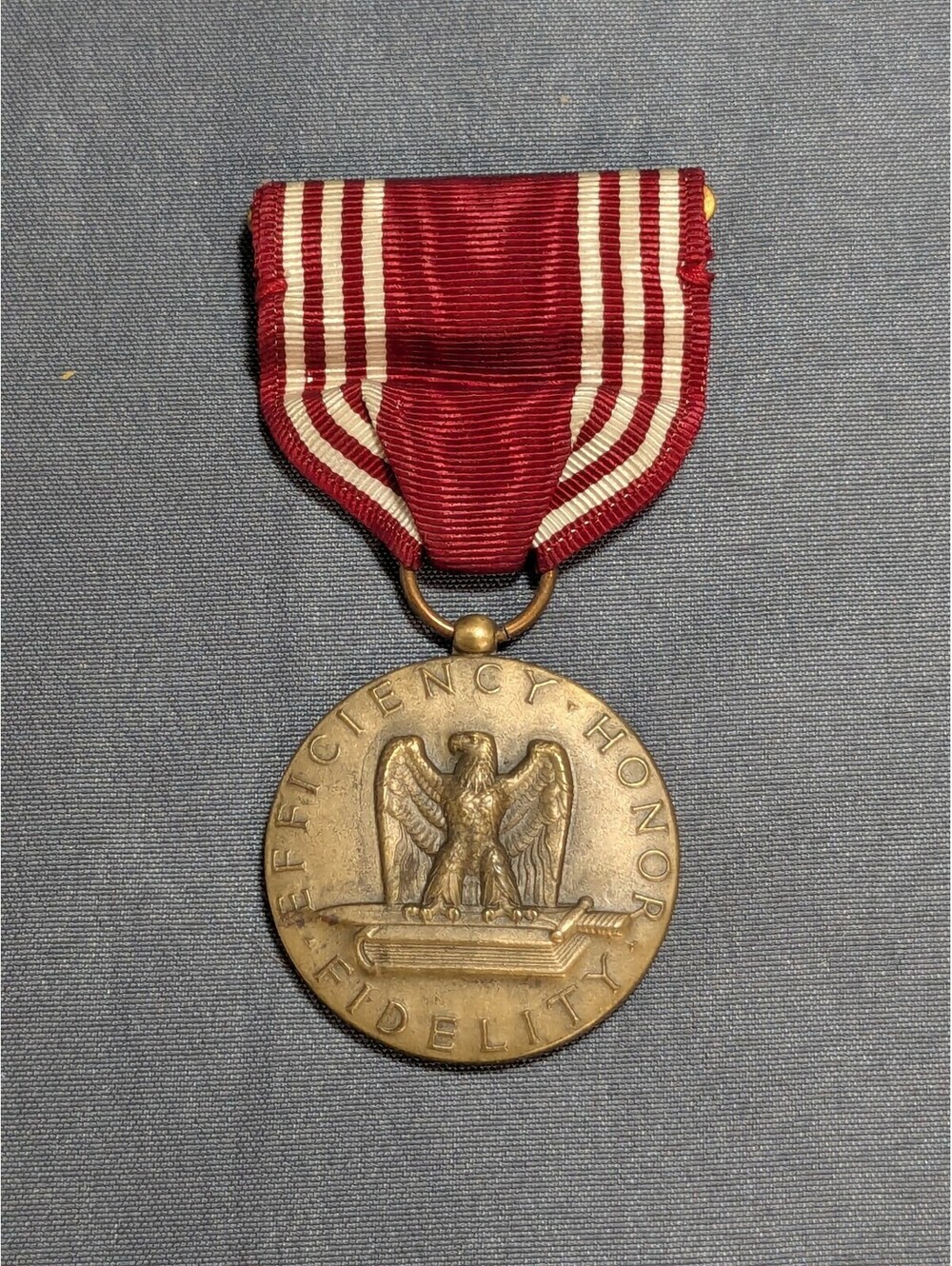 Vintage Military Service Medal with Red and White Ribbon
